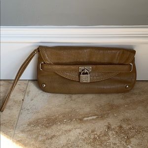 Caramel brown colored J Lo brand wristlet